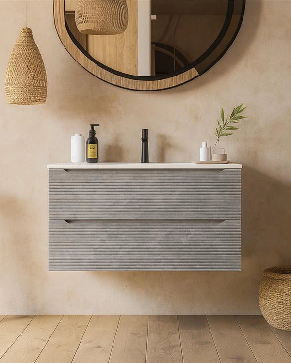 Mobile bagno grigio 80x45 San Marino con lavabo in in mineralmarmo con lavabo e rubinetteria, vista frontale su sfondo...