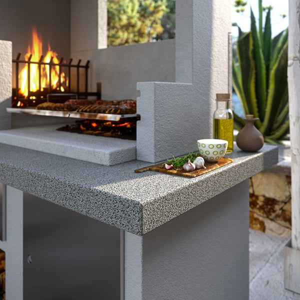 Palazzetti Antille 2 barbecue con forno a legna grezzo con braciere laterale con piano in Marmotech effetto granito grigio