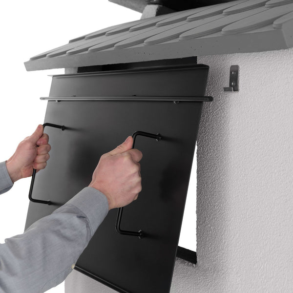 Palazzetti Trinidad 2 barbecue con grill extralarge e Grey accesa in soggiorno, fiamma visibile attraverso il vetro