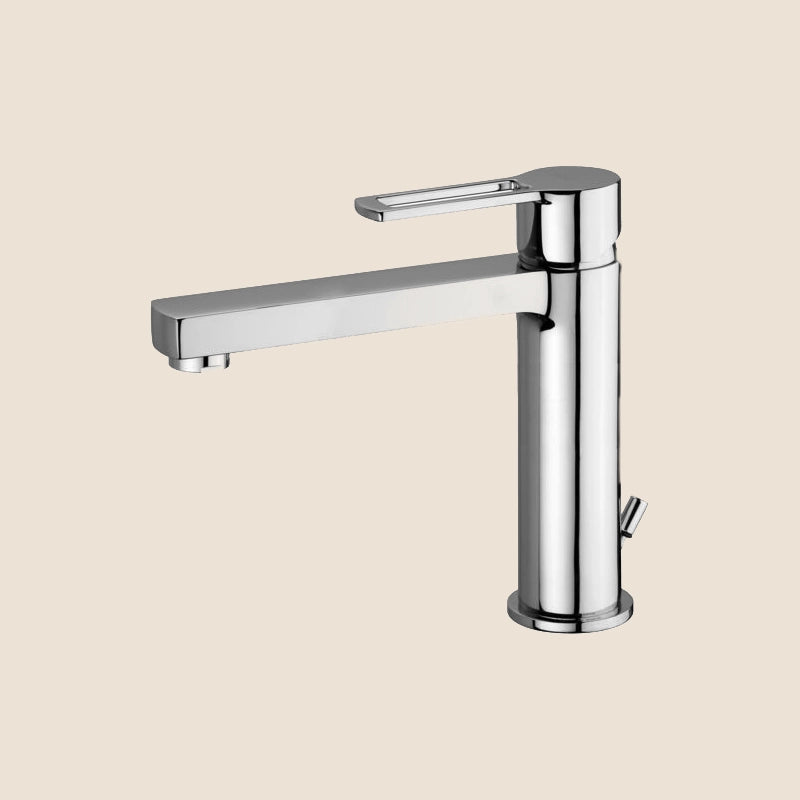 Paffoni Ringo Rin073 Miscelatore lavabo Scarico Automatico ambientato su piano bagno con accessori