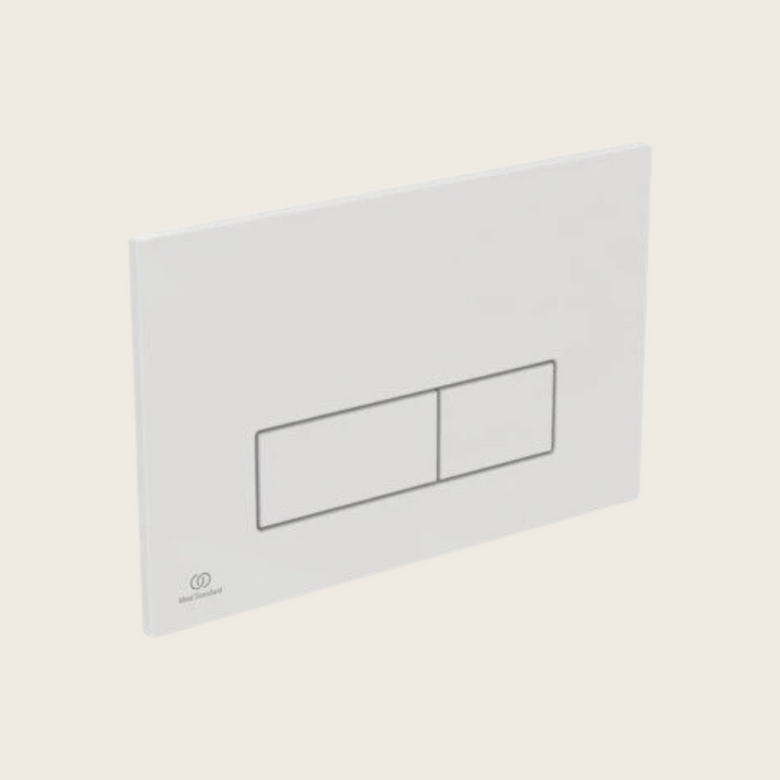 Placca comando meccanico per cassette wc Prosys bianco ambientato su piano bagno con accessori