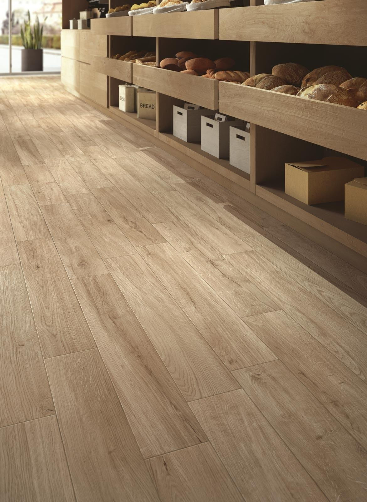 Pavimento 15x90 effetto parquet 8 mm in Gres Porcellanato posata in ambiente arredato, dettaglio della venatura