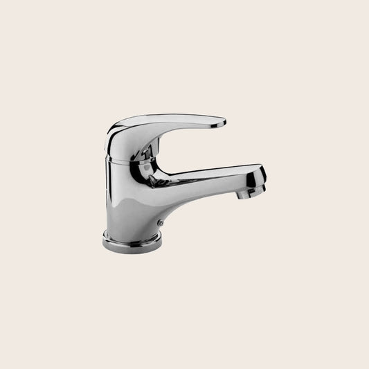 Paffoni Apollo Miscelatore lavabo Monocomando Cromo APM070CR Cromato in lucido ambientato su piano bagno con accessori