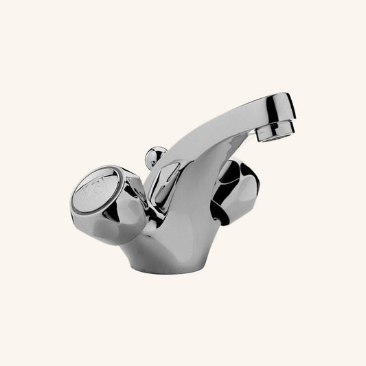 Paffoni Danubio Da070 Gruppo Lavabo Con Scarico Automatico ambientato su piano bagno con accessori