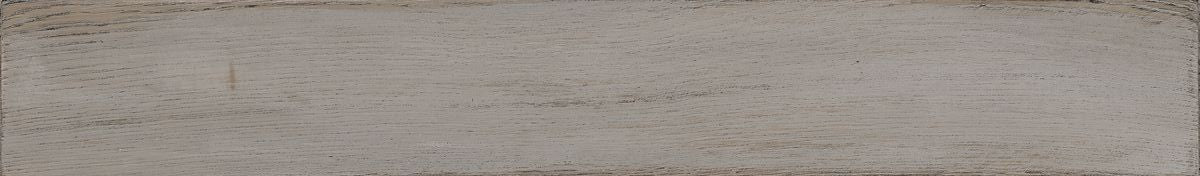 Pavimento 10x70 effetto parquet in Gres Porcellanato Grey Grigio posata in ambiente arredato, dettaglio della venatura