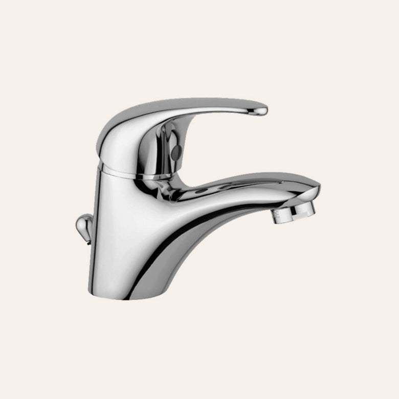 Paffoni Nettuno Due Nd075 Miscelatore lavabo scarico ambientato su piano bagno con accessori