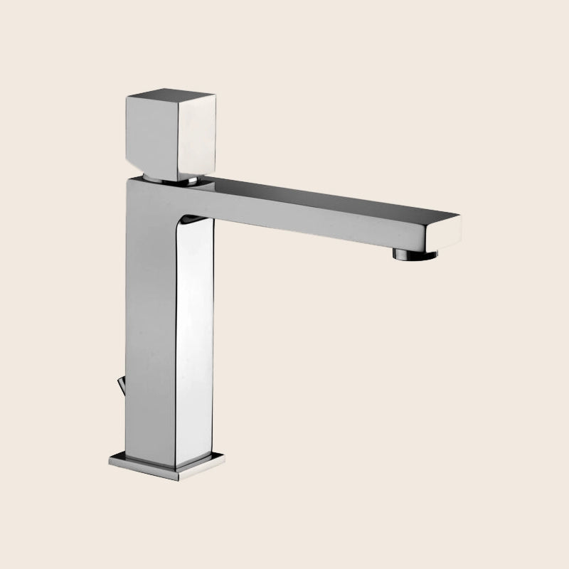 Paffoni Elle Elx073 Miscelatore Lavabo Medio Scarico in lucido ambientato su piano bagno con accessori