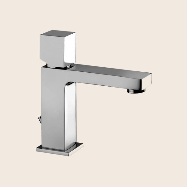 Paffoni Elle Elx075 Miscelatore Lavabo Con Leva Cubo Cromo in lucido ambientato su piano bagno con accessori