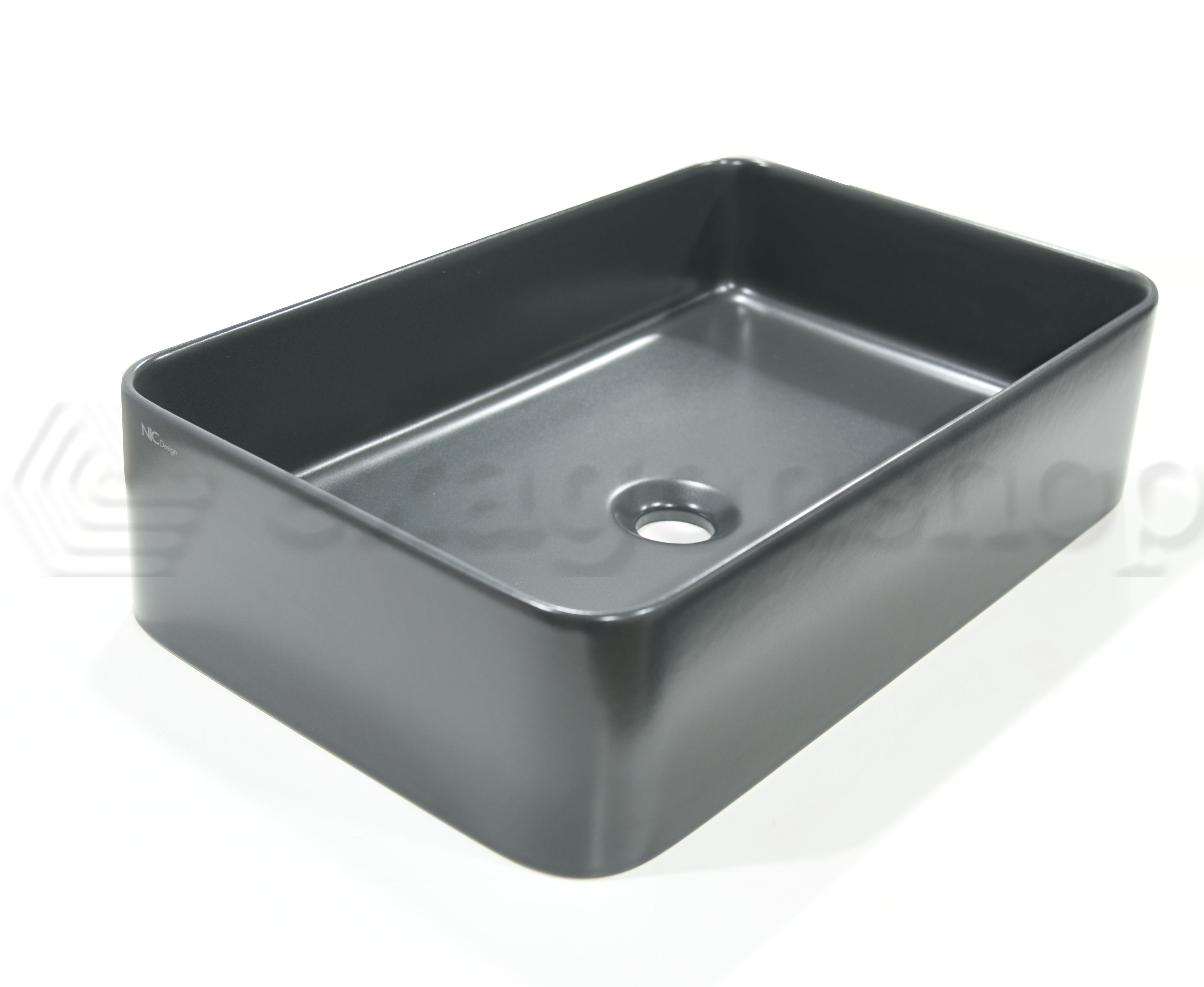 Lavabo 55x36 Rettangolare seconda scelta Basalto Matt ambientato su piano bagno con accessori - Nic Design