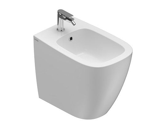 Globo Genesis Bidet filo parete a pavimento con fissaggi in ceramica e lucido ambientato su piano bagno con accessori...