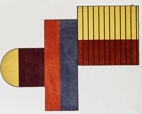 Antonio Lupi Geometrie Volanti Tappeto 250x350 in Velluto Multicolor ambientato in spazio living con arredi coordinati...