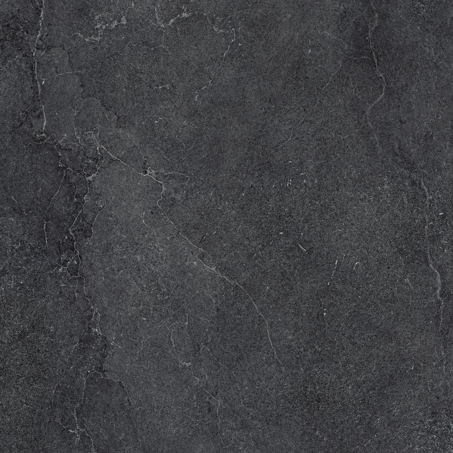 Cotto D'Este Kerlite Lithos 6plus Pavimento Rivestimento Carbon Lt posata in ambiente arredato, dettaglio della venatura...