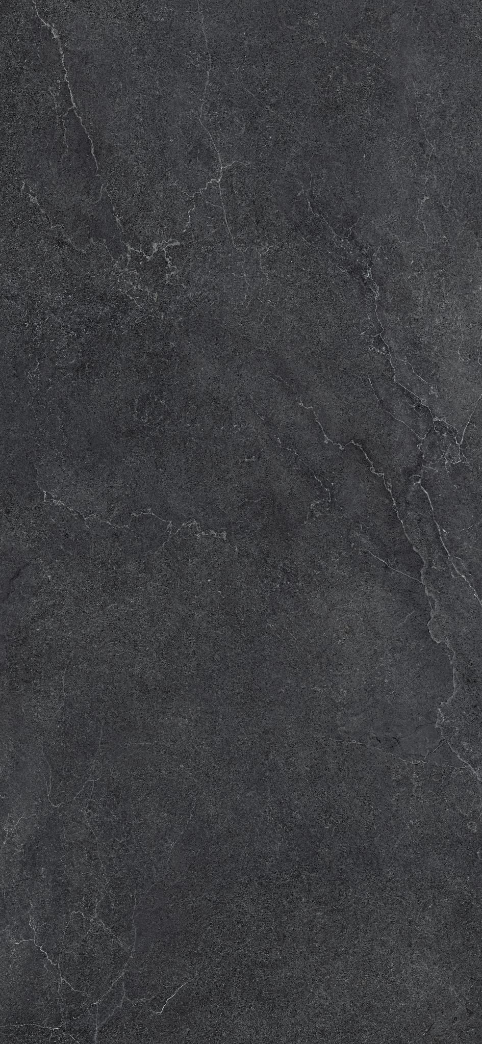 Cotto D'Este Kerlite Lithos 6plus Pavimento Rivestimento Carbon Lt posata in ambiente arredato, dettaglio della venatura...