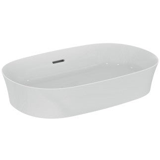 Lavabo Ovale 60x38 Da Appoggio Senza Foro Bianco Ipalyss in porcellana ambientato su piano bagno con accessori