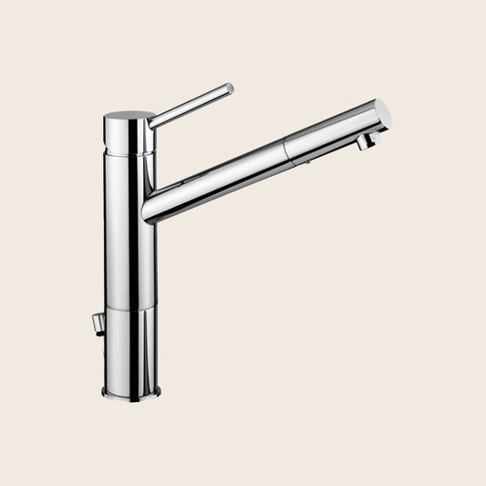Paffoni Birillo Miscelatore lavabo canna lunga con prolunga in lucido ambientato su piano bagno con accessori