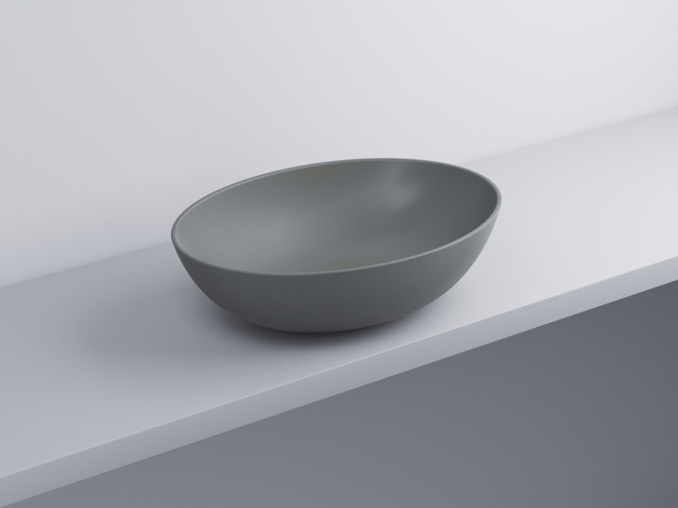 Cielo Eco Small Bacinella 58x42 Ovale Da Appoggio Senza in ceramica ambientato su piano bagno con accessori