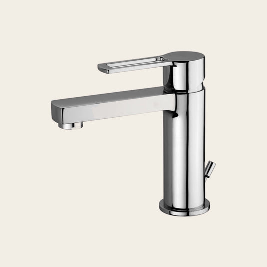 Paffoni Ringo Rin075 Miscelatore lavabo con Scarico in lucido ambientato su piano bagno con accessori