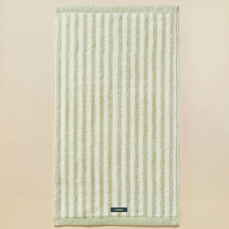 Cosmic Stripes Asciugamano da bagno 50x90 aqua mint in naturale montato a parete, vista del design e della finitura...