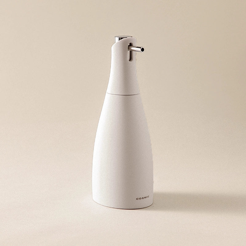 Dispenser sapone liquido Pietra Soft Saku Cosmic in naturale montato a parete, vista del design e della finitura...
