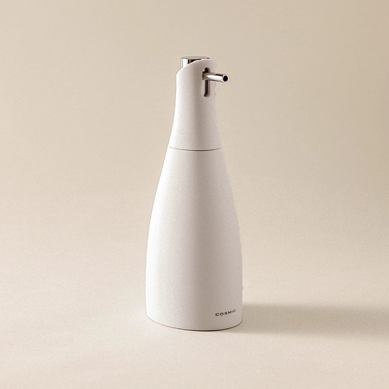 Dispenser sapone liquido Pietra Soft Saku Cosmic in naturale montato a parete, vista del design e della finitura...