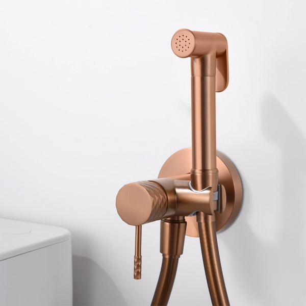 Doccetta bidet con miscelatore Memo incasso oro rosa in spazzolato, vista frontale della maniglia e della bocca di...