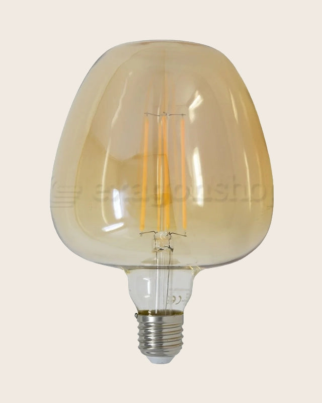 Lampadina amber Vintage E27 luce calda 820 lumen 2700k Giallo accesa in ambiente, design e diffusione della luce - Exagonshop