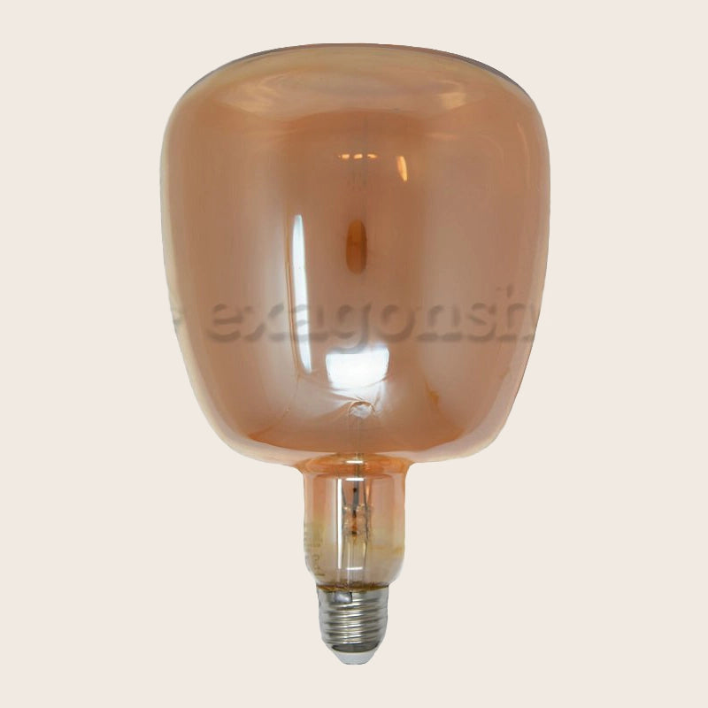 Lampadina ambra Vintage E27 luce calda 310 lumen 2700k accesa in ambiente, design e diffusione della luce - Exagonshop