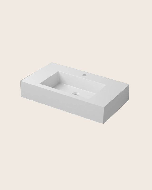 Lavabo 80x46 sospeso in resina bianco lucido in naturale ambientato su piano bagno con accessori - Exagonshop