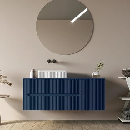 Mobile bagno 120x46 Urbino cannettato petrolio con anta e con lavabo e rubinetteria, vista frontale su sfondo neutro...