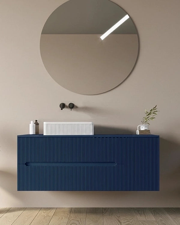 Mobile bagno 90x46 Urbino cannettato petrolio con anta e con lavabo e rubinetteria, vista frontale su sfondo neutro...