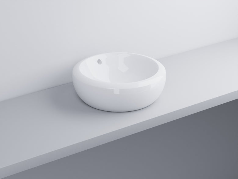 Cielo Fluid Lavabo 45 Cm Da Appoggio Senza Foro Con in ceramica e lucido ambientato su piano bagno con accessori