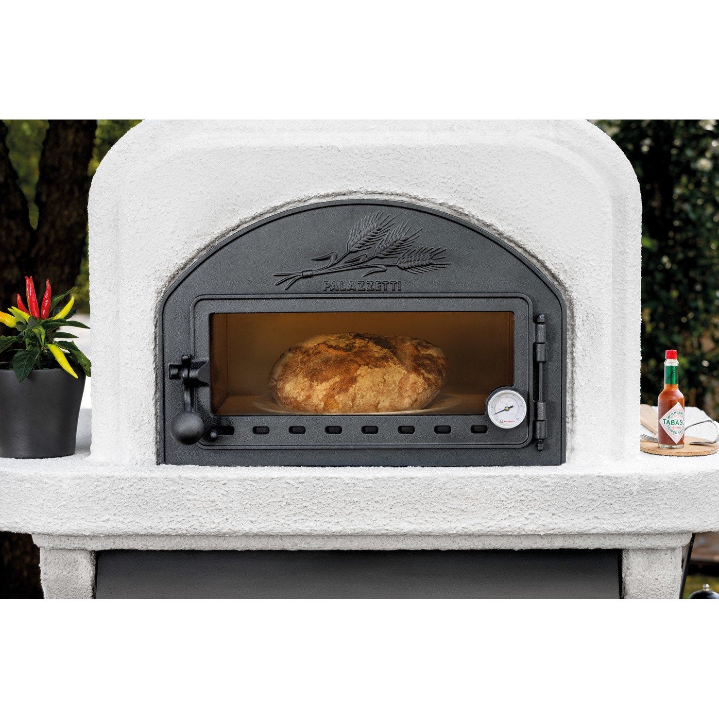 Palazzetti Capri 3 barbecue a legna con forno esterno in acciaio con piano in Marmotech effettto granito grigio