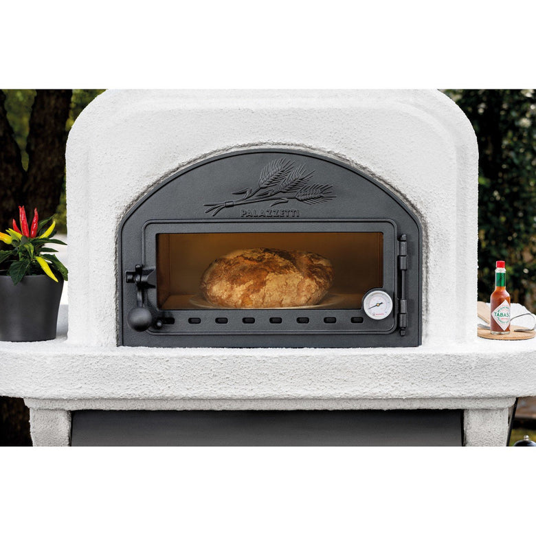 Palazzetti Capri 3 barbecue a legna con forno e piano in, vista laterale che mostra profilo e dimensioni