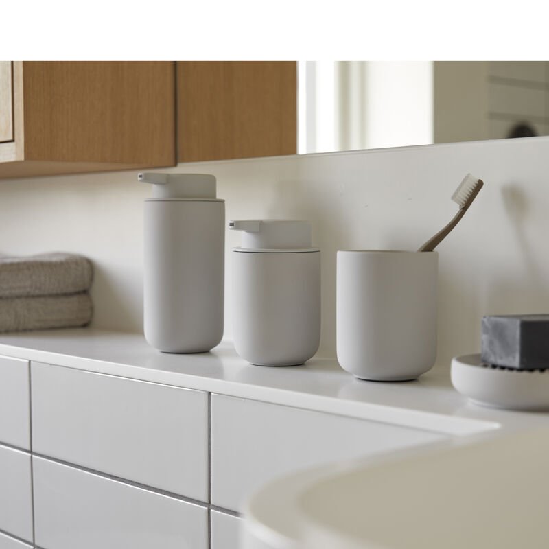 Dispenser sapone da appoggio 0,25 l in gres e abs soft, vista laterale del profilo a muro