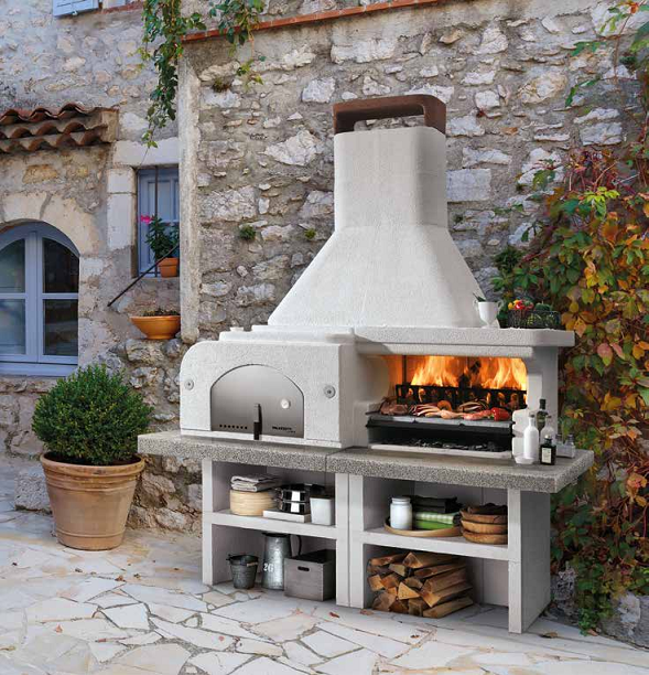 Palazzetti Gargano 3 barbecue a legna grezzo con forno e accesa in soggiorno, fiamma visibile attraverso il vetro