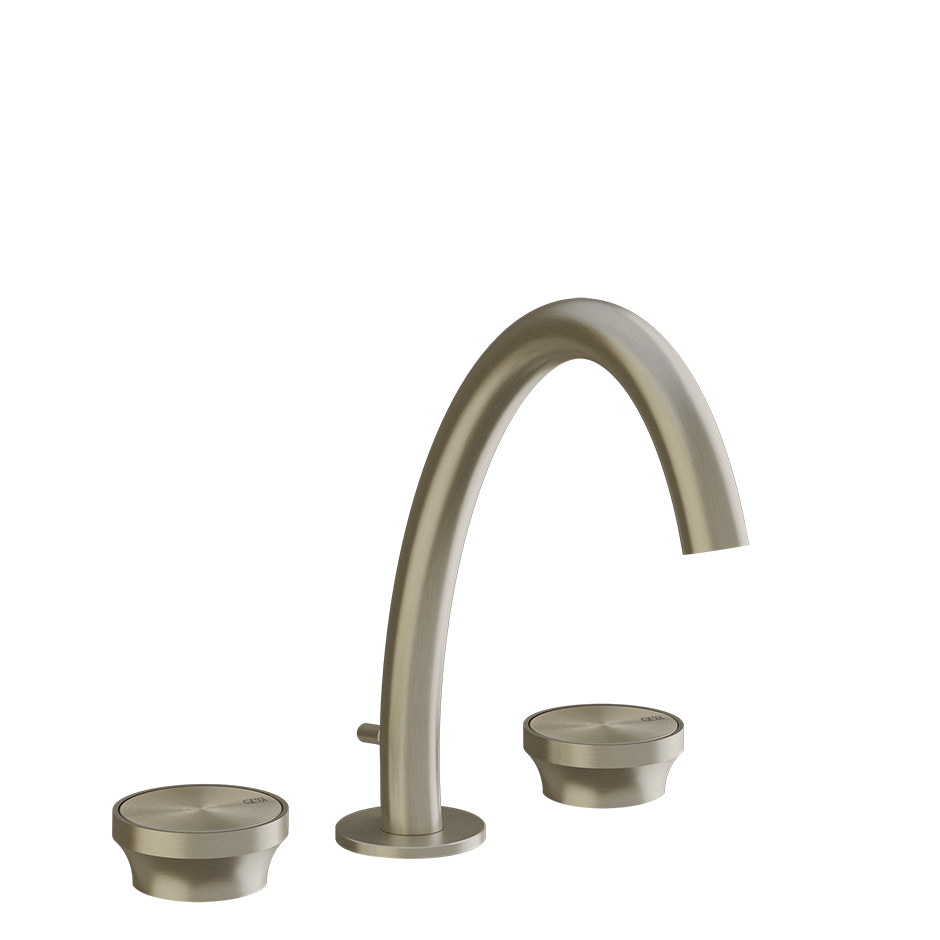 Gessi Gruppo lavabo 3 fori medio con scarico brass brushed ambientato su piano bagno con accessori