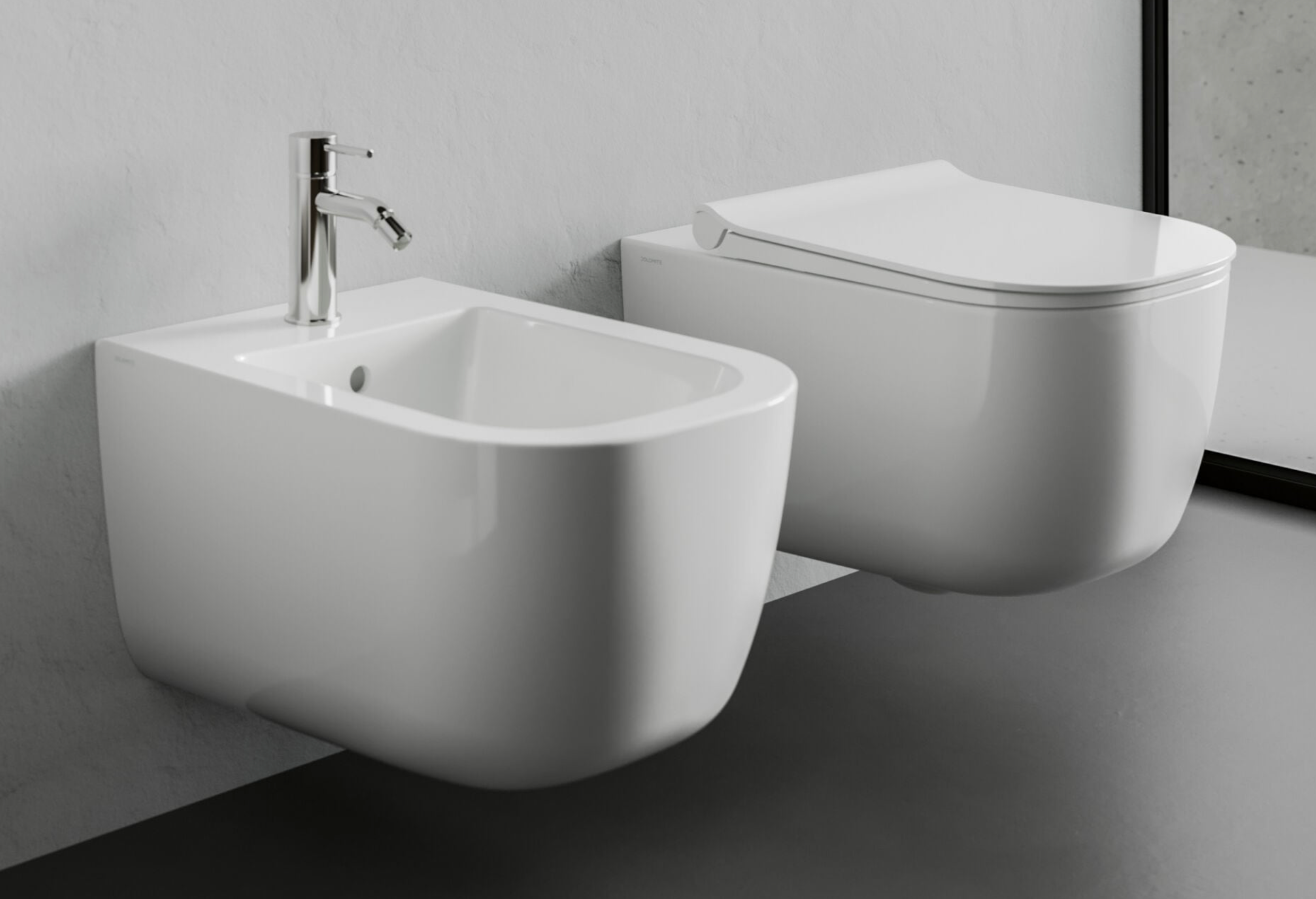 Dolomite Coppia sanitari sospesi Mirto sedile rallentato, vista frontale su sfondo bianco - Ceramica Dolomite