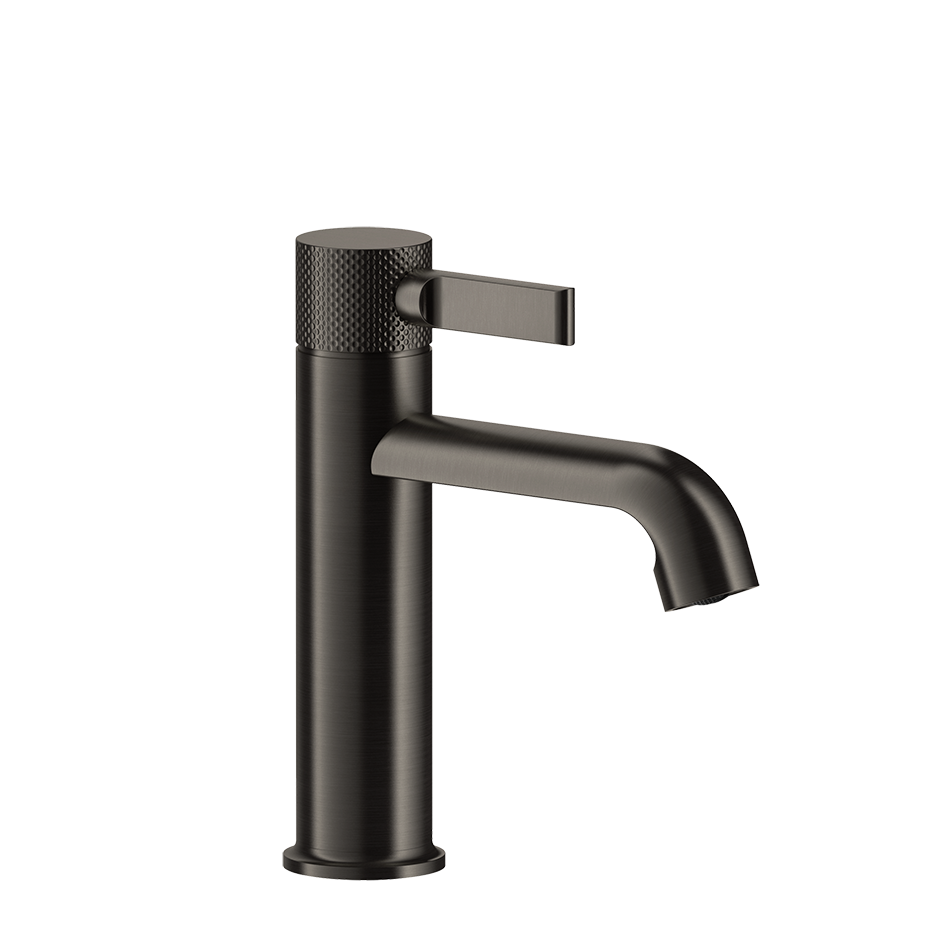 Gessi Inciso Miscelatore lavabo monocomando con scarico ambientato su piano bagno con accessori