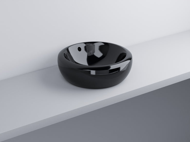 Cielo Fluid Lavabo 45 Cm Da Appoggio Senza Foro Con in ceramica e lucido ambientato su piano bagno con accessori