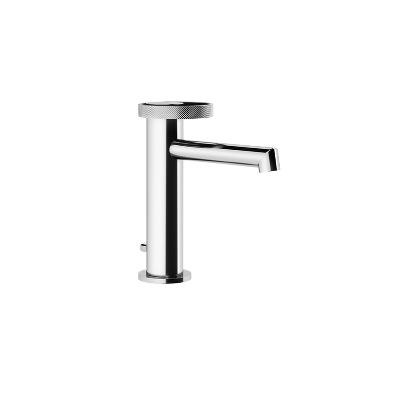 Gessi Anello Rubinetto miscelatore lavabo monocomando con Cromo Lucido ambientato su piano bagno con accessori