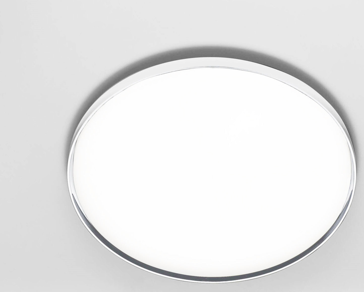 Flos Clara Lampada a parete e soffitto 60 cm cornice in policarbonato accesa in ambiente, design e diffusione della luce