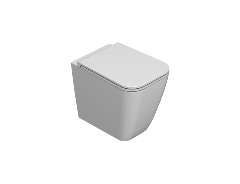 Globo Stone Multi Wc filo parete Senza Brida a pavimento in ceramica e lucido ambientato su piano bagno con accessori...