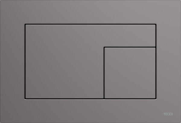 Tece tecevelvet placca wc 2 pulsanti fenix ntm grigio londra ambientato su piano bagno con accessori - Tece Italia